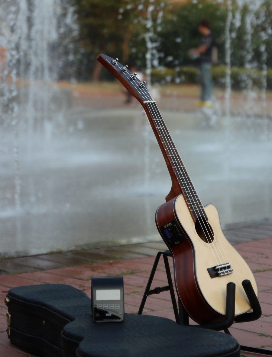 A Namuai ukulele on location, headstock in focus