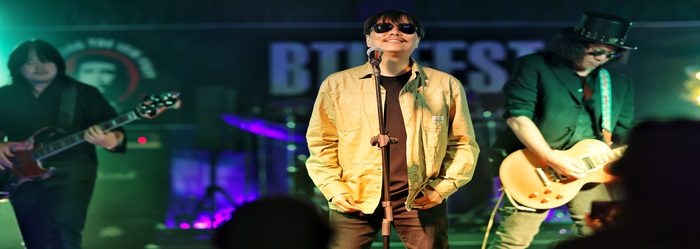 A band performing live on stage at Namuai Live Hall